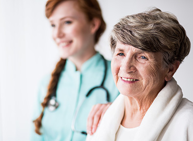 Home Health nurse supporting a patient.